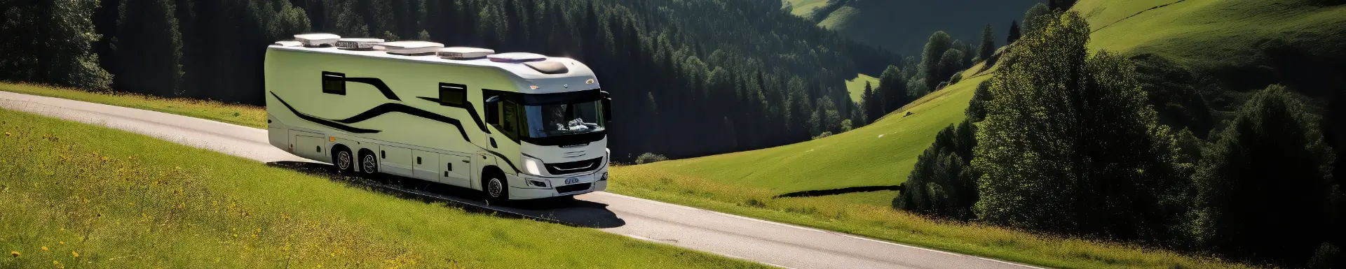 A large RV drives through the mountains